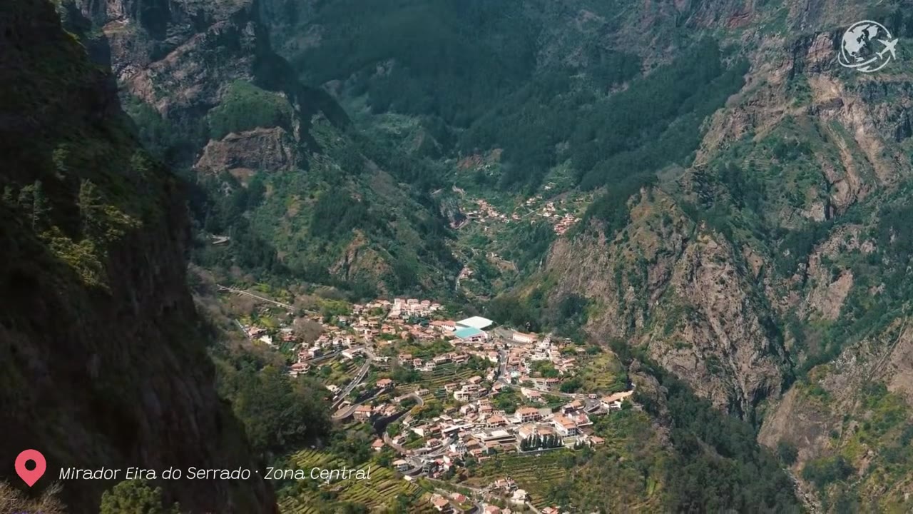 View from Eira do Serrado viewpoint over the green mountain walls surrounding Curral das Freiras village